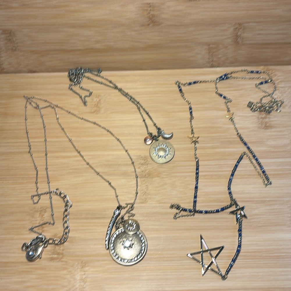 Bundle of 3 celestial gold tone necklaces.